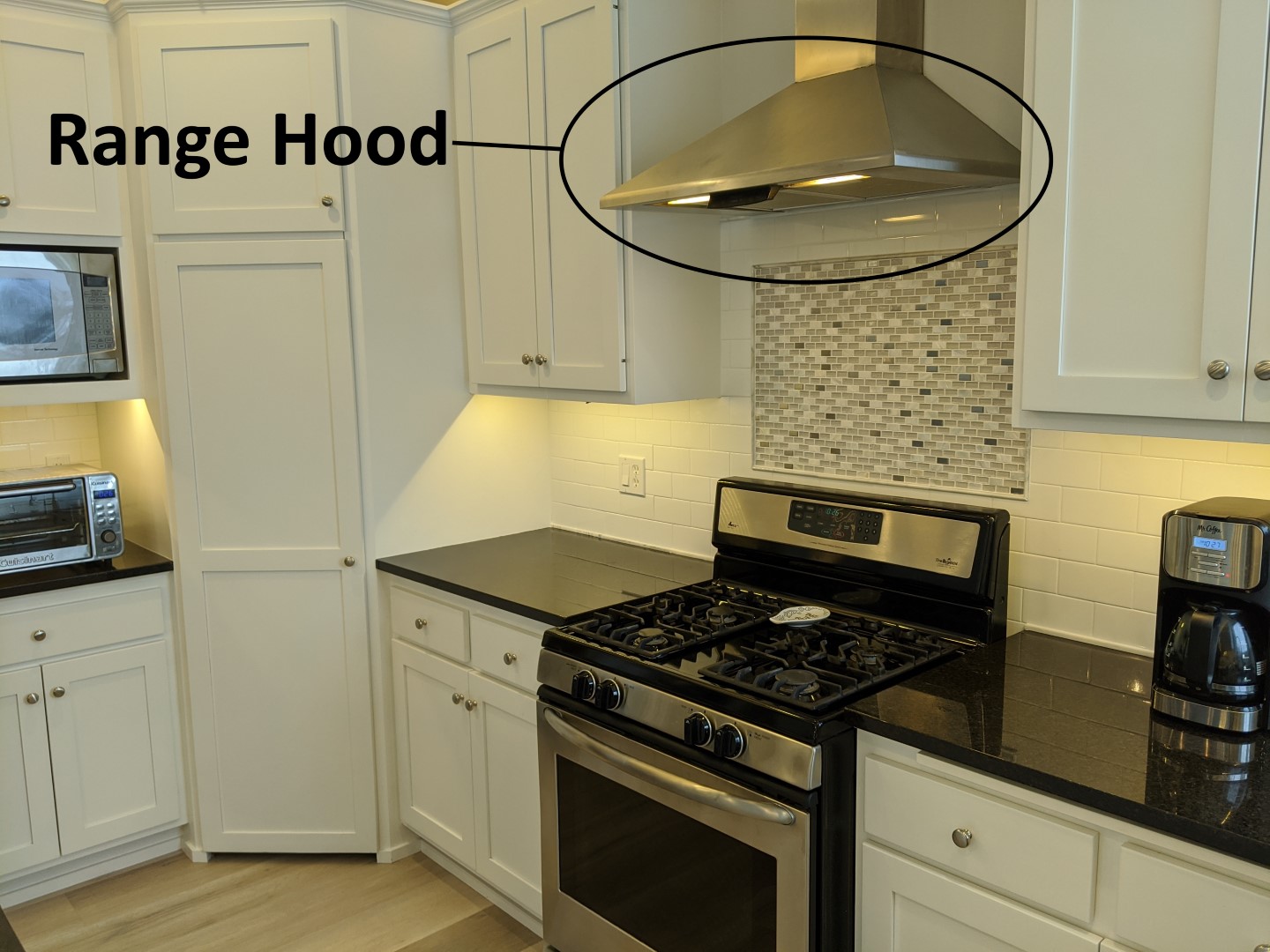Kitchen range hoods are for all kitchens, not just above gas ovens -  Structure Tech Home Inspections